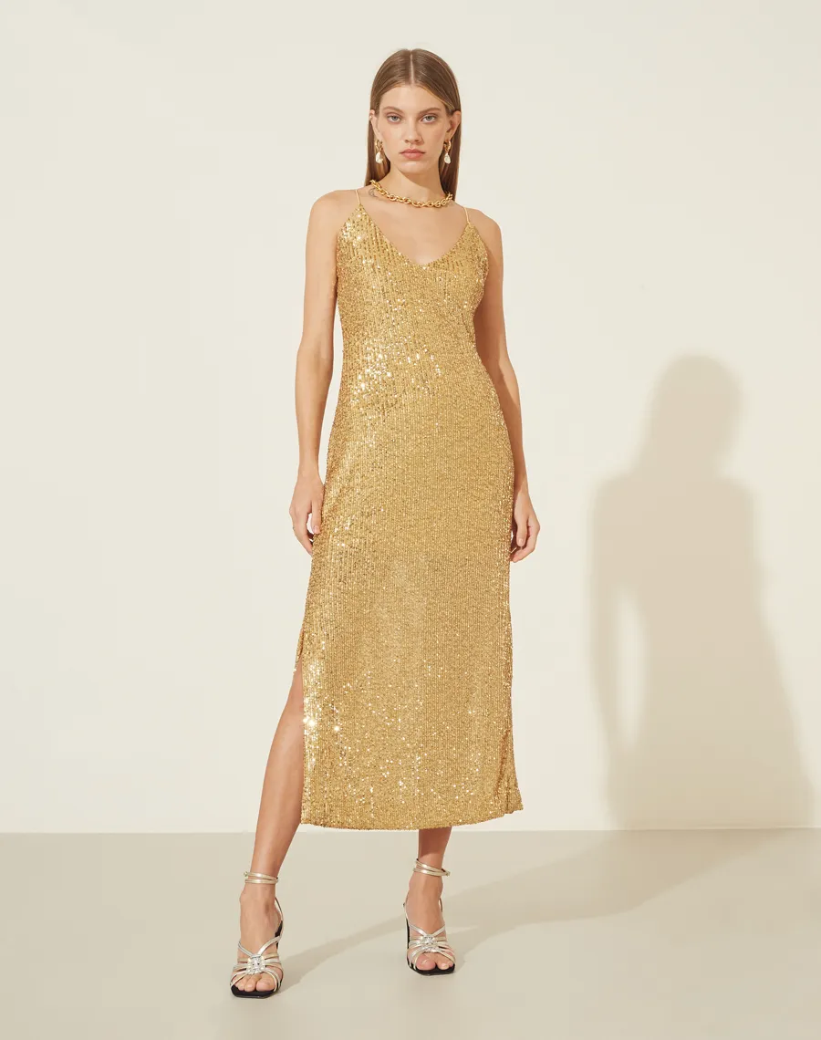 Vestido Paetê Freedom com forro curto, decote V na frente e nas costas com alcinhas finas.<BR>Possui zíper invisível para fechamento lateral e abertura nas laterais abaixo do joelho.<BR>
