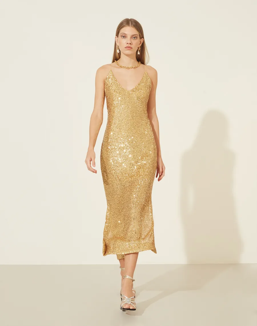 Vestido Paetê Freedom com forro curto, decote V na frente e nas costas com alcinhas finas.<BR>Possui zíper invisível para fechamento lateral e abertura nas laterais abaixo do joelho.<BR>