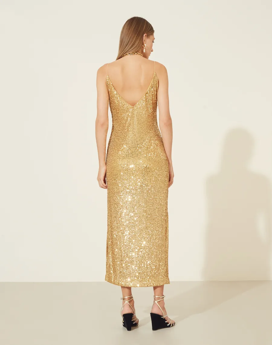 Vestido Paetê Freedom com forro curto, decote V na frente e nas costas com alcinhas finas.<BR>Possui zíper invisível para fechamento lateral e abertura nas laterais abaixo do joelho.<BR>