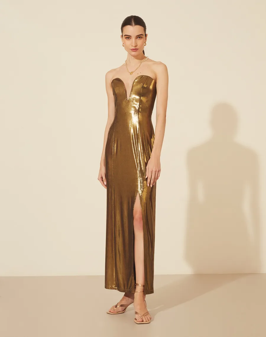 Vestido Lamê Lucy possui decote profundo de coração com sustentação interna, forro curto com fenda lateral e alças finas, que podem ou não ficar à mostra. Seu fechamento é por zíper invisível posterior.<br/>