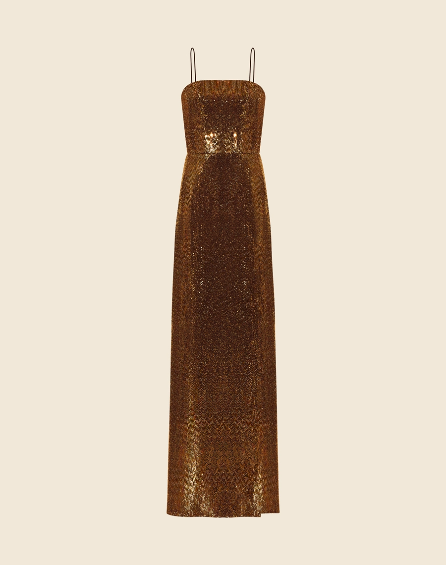 <BLOCO01>
Vestido Longo Heloise, confeccionado em malha com paetê .<br/>
Vestido longo com decote quadrado e alças finas, possui forro curto. <br/>
Seu fechamento é por zíper interno para fechar o corset e externo atrás. <br/>
O vestido Heloise possui corset interno dando mais estrutura e uma modelagem mais justa deixando a peça mais elegante o corpo. <br/>
</BLOCO01>