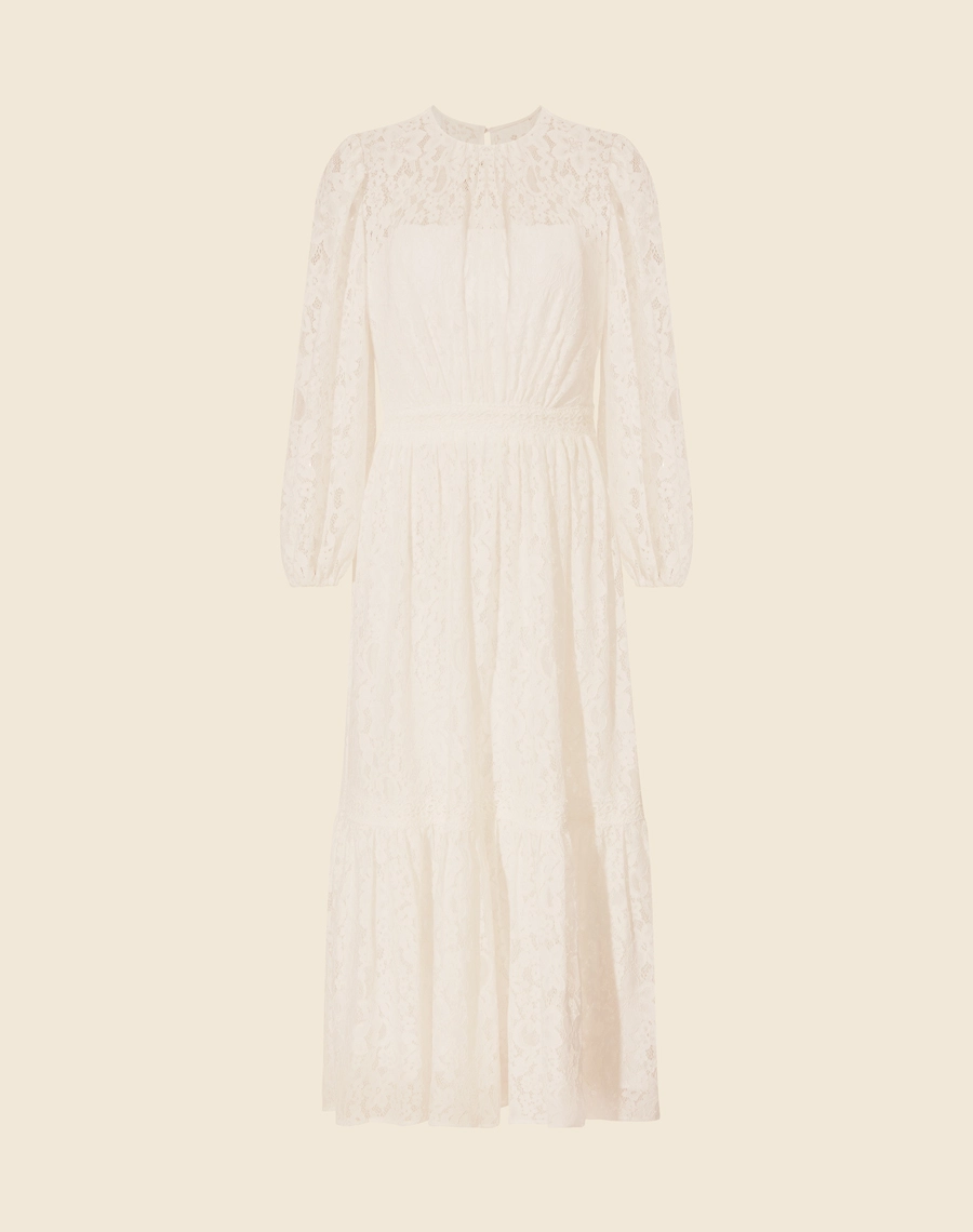 Vestido Midi Laila confeccionado em renda. Seu decote é redondo, mangas longas com detalhe de elástico interno no punho. <br/>

