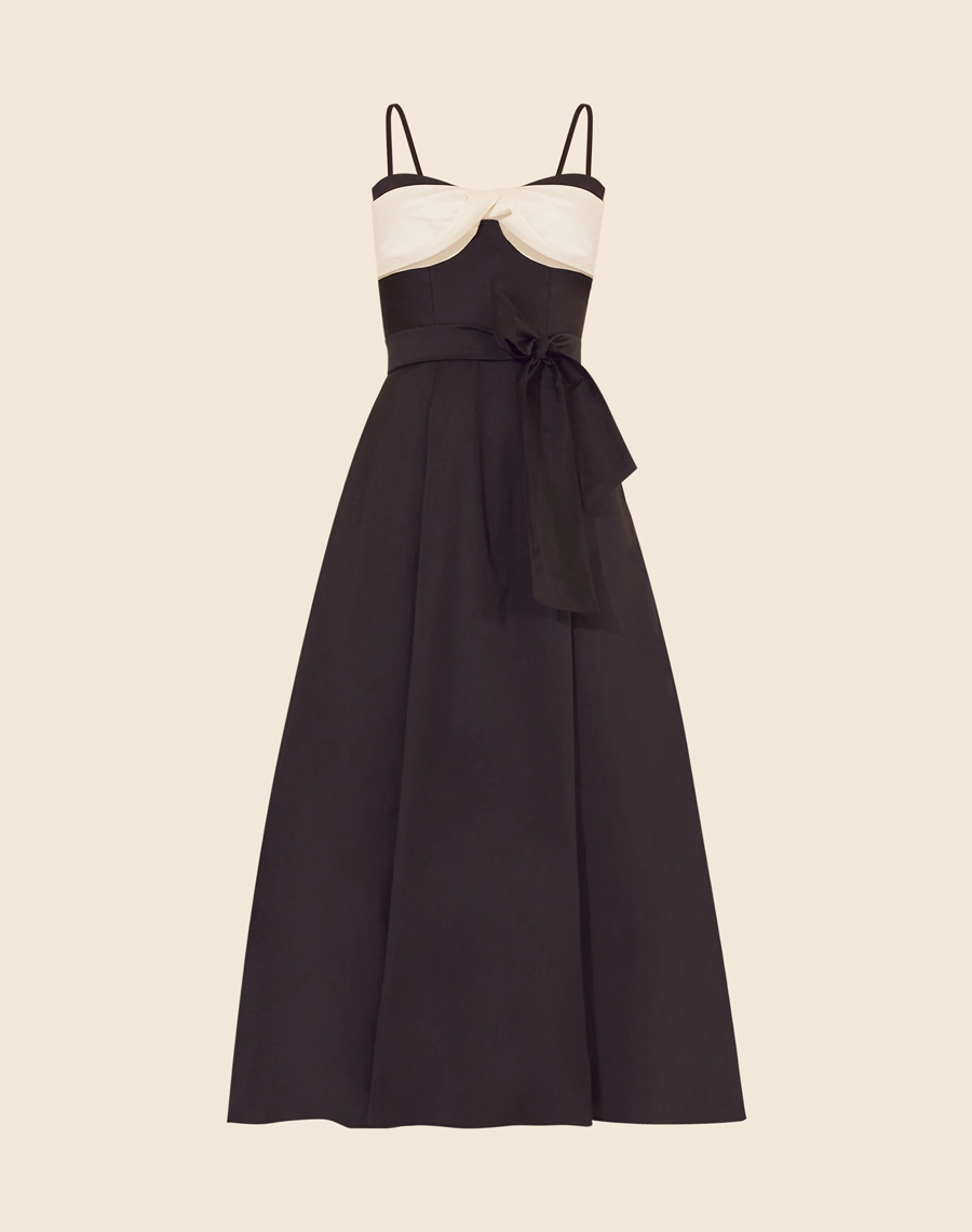 Vestido Midi Jimena confeccionado em tafetá, um tecido acetinado e de leve estrutura. 