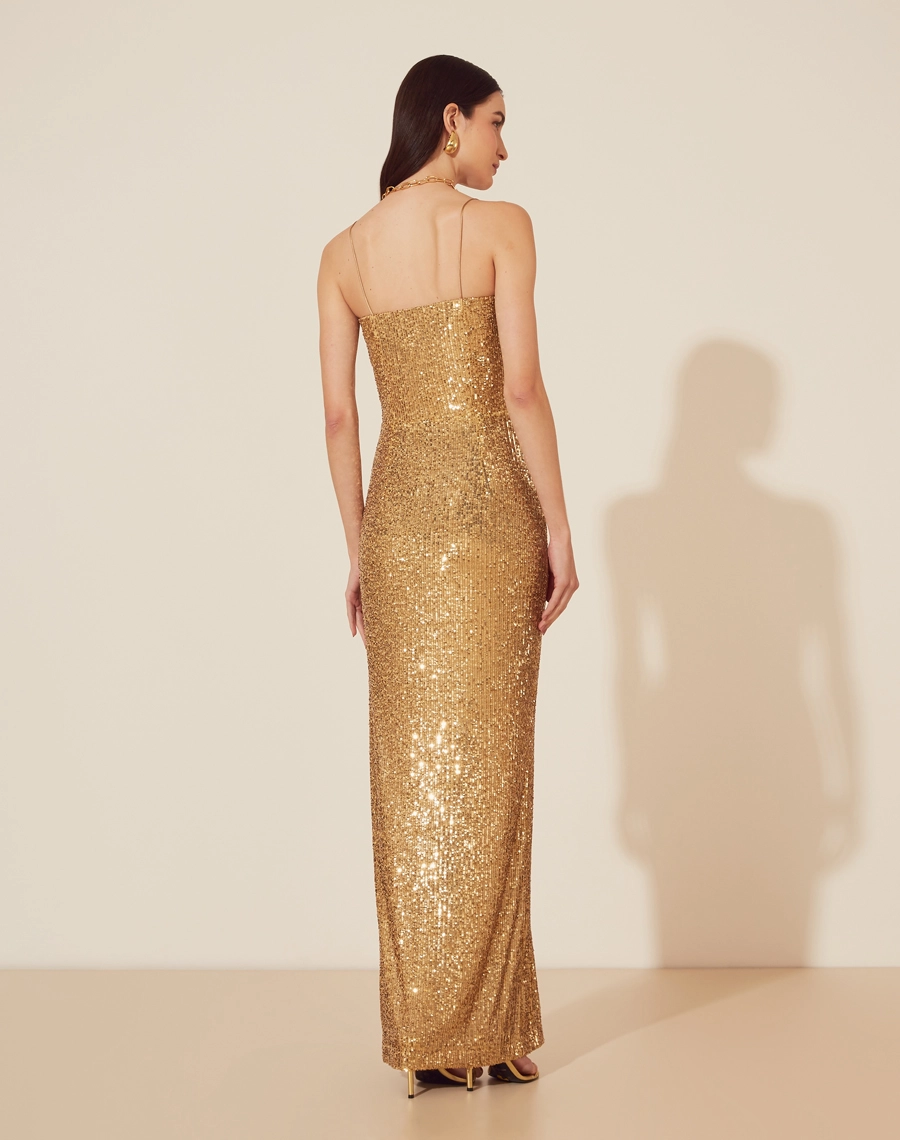 Vestido Longo Acalia peça confeccionada em Paetê, com decote quadrado e alças finas.<br/>
Seu fechamento em zíper invisível nas costas oferece um acabamento discreto e elegante. <br/>

