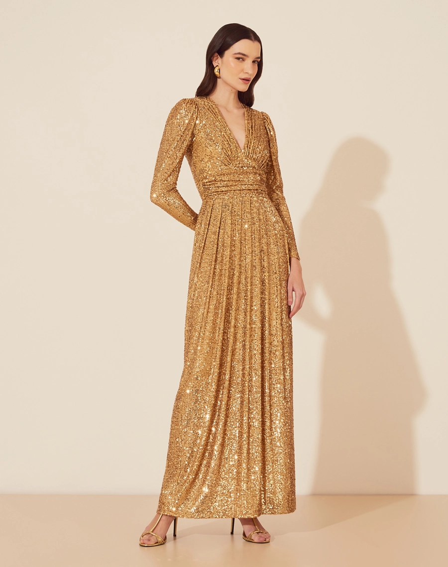 Vestido Longo Bella é uma peça deslumbrante, confeccionada em paetê que garante um brilho espetacular em qualquer evento. 