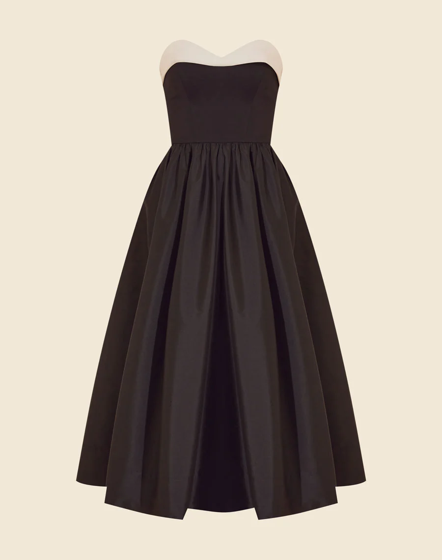 Vestido Midi Gloria é confeccionado em Tecno Prada no corpete e com uma saia volumosa de tafetá. O modelo destaca-se pelo caimento impecável, sendo deal para ocasiões que pedem estilo e conforto. 