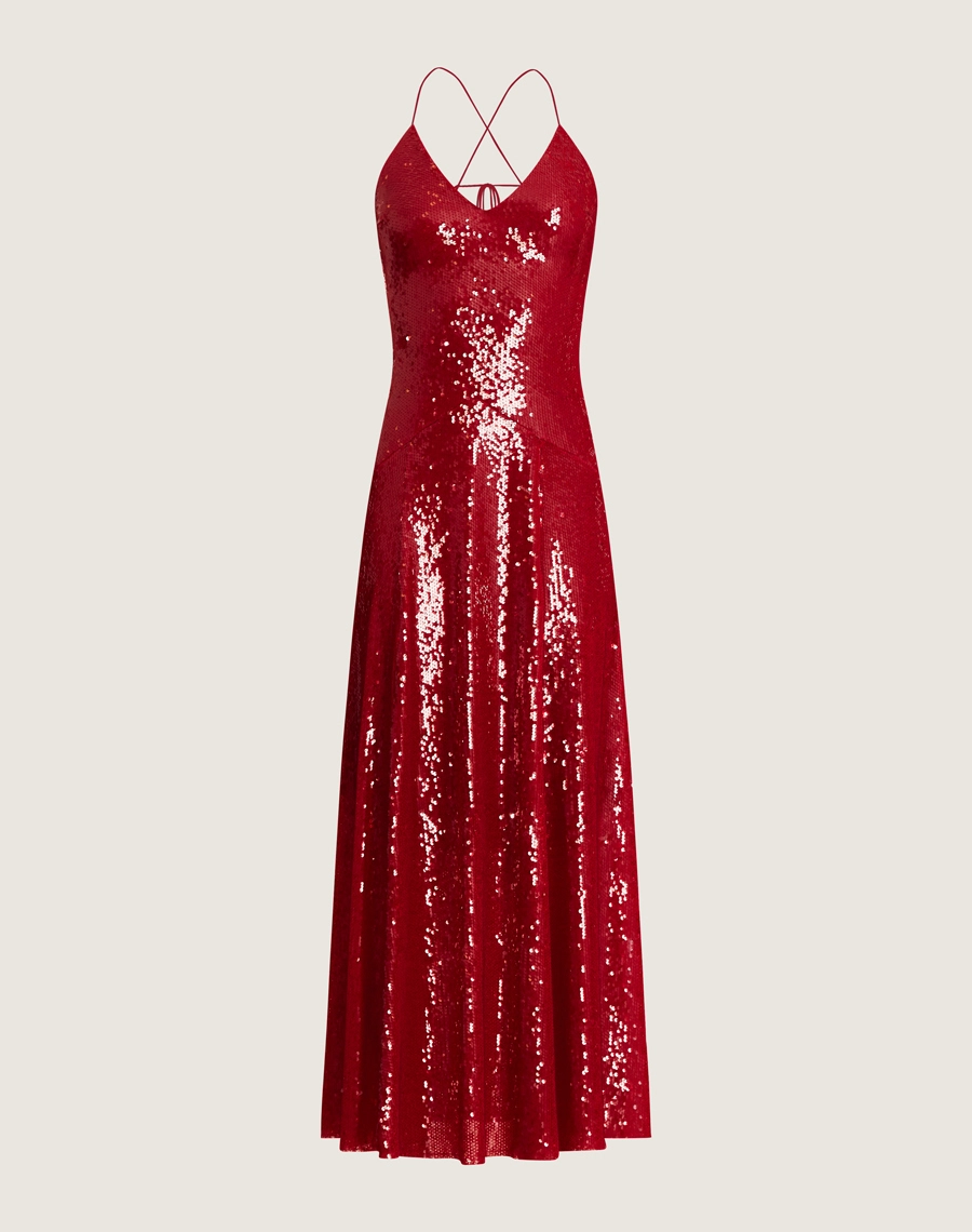 Vestido longo de paetê com alças cruzadas, decote em V e caimento fluido. Glamour e conforto para festas e eventos sofisticados.