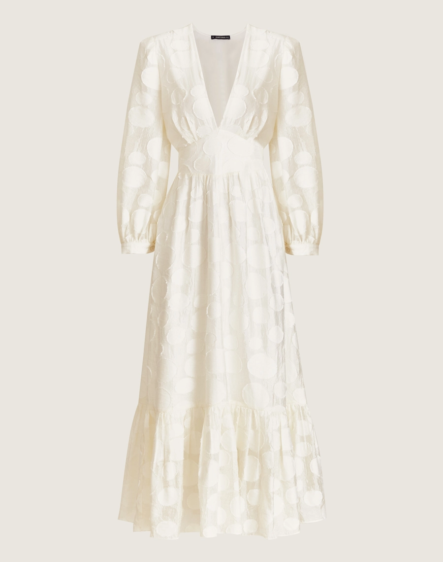 O Vestido Midi Moss é confeccionado em viscose mista com detalhes geométricos bordados, possuindo caimento fluido e sendo menos propenso a amassar, perfeito para o dia a dia. Esse vestido midi é versátil e elegante, perfeito para passeios diurnos, almoços casuais ou coquetéis informais.