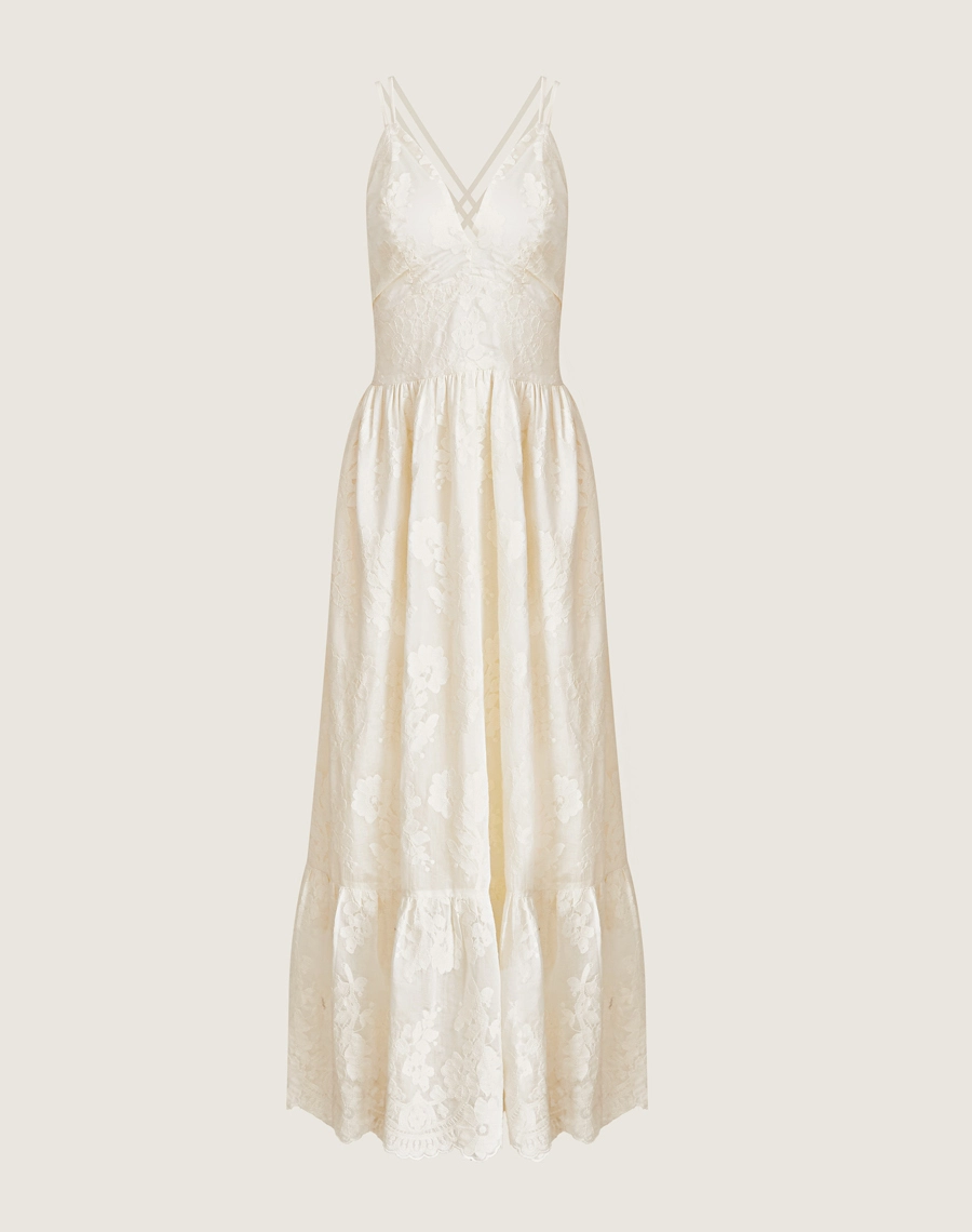 O Vestido Longo Suelen é confeccionado em cambraia bordada. Perfeito para quem busca um visual delicado e romântico. Ideal para brunches, casamentos ou encontros especiais.