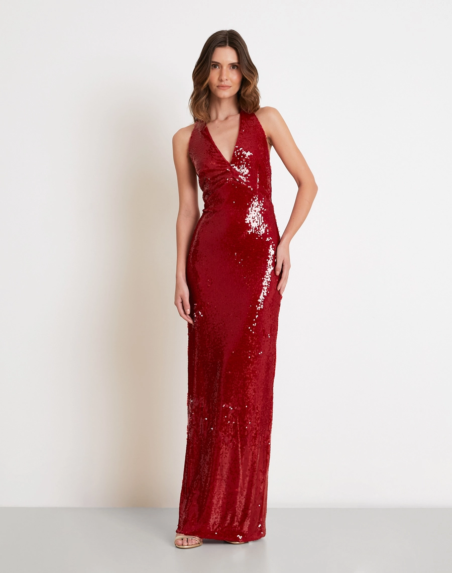 O Vestido Longo Ada é confeccionado em tecido de paetê de alta qualidade, possui brilho intenso e acabamento sofisticado, criando um efeito luminoso que valoriza a peça em todos os ângulos.