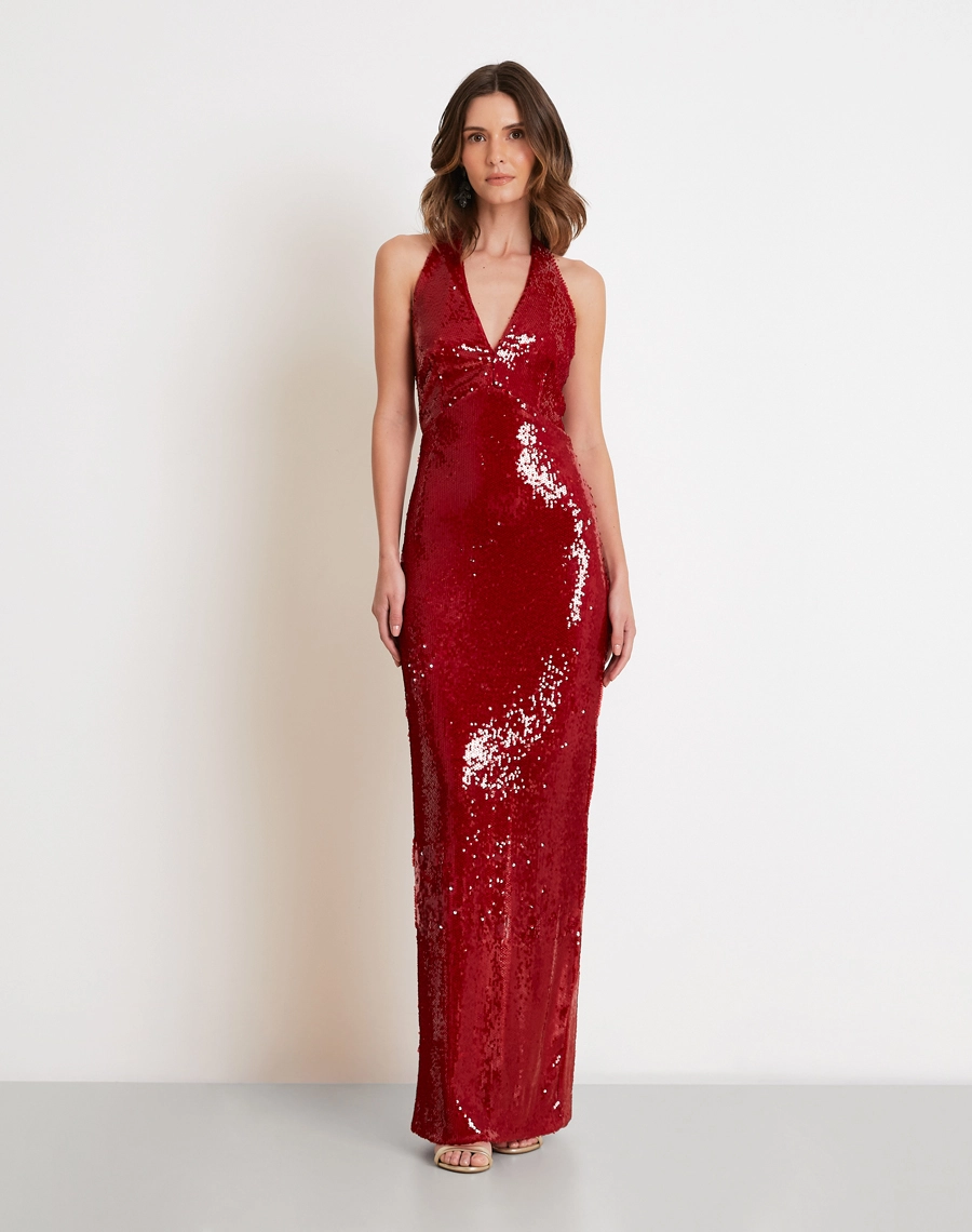 O Vestido Longo Ada é confeccionado em tecido de paetê de alta qualidade, possui brilho intenso e acabamento sofisticado, criando um efeito luminoso que valoriza a peça em todos os ângulos.