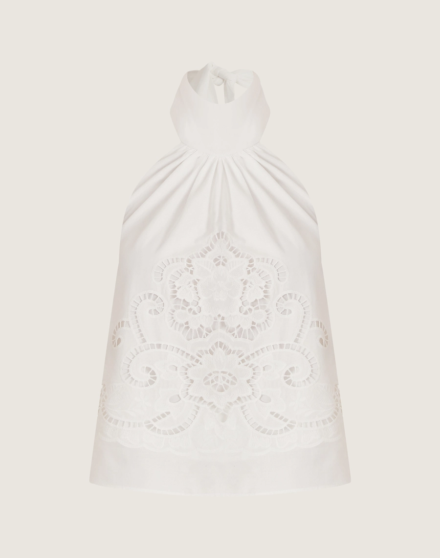 O Top Perola é confeccionada laise, um tecido que oferece um caimento leve e fluido, ideal para quem busca conforto e elegância.