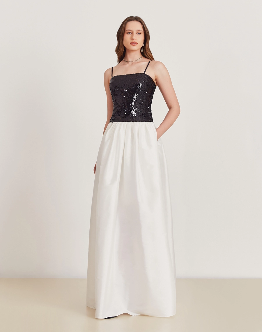 O Vestido Longo Betty é confeccionado em tafetá e paetê. É a escolha perfeita para eventos de gala, formaturas ou ocasiões que pedem um look de impacto.