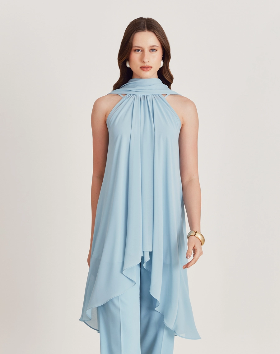 A Blusa Juliete é confeccionada Youro tingido, um tecido que oferece um caimento leve e fluido, ideal para quem busca conforto e elegância. <br/>