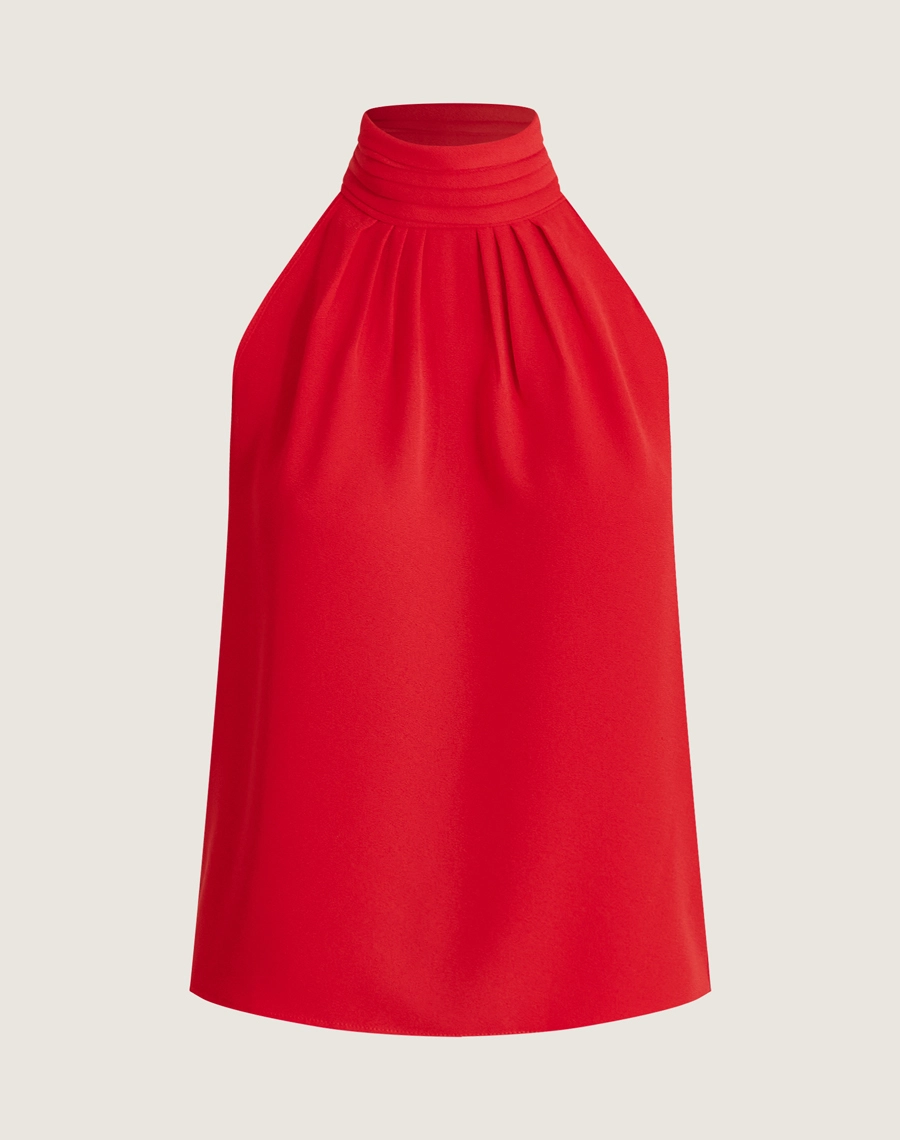 O Top Lauren é confeccionado em crepe bibi, um tecido leve, elegante e com toque macio, conhecido por seu caimento perfeito e textura levemente acetinada.