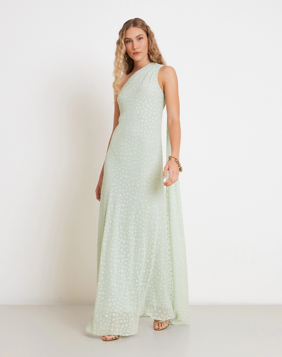 O Vestido Longo Kenya é confeccionado em tecido Jacquard, de aspecto texturizado e delicado, com padronagem sutil que valoriza a superfície da peça.