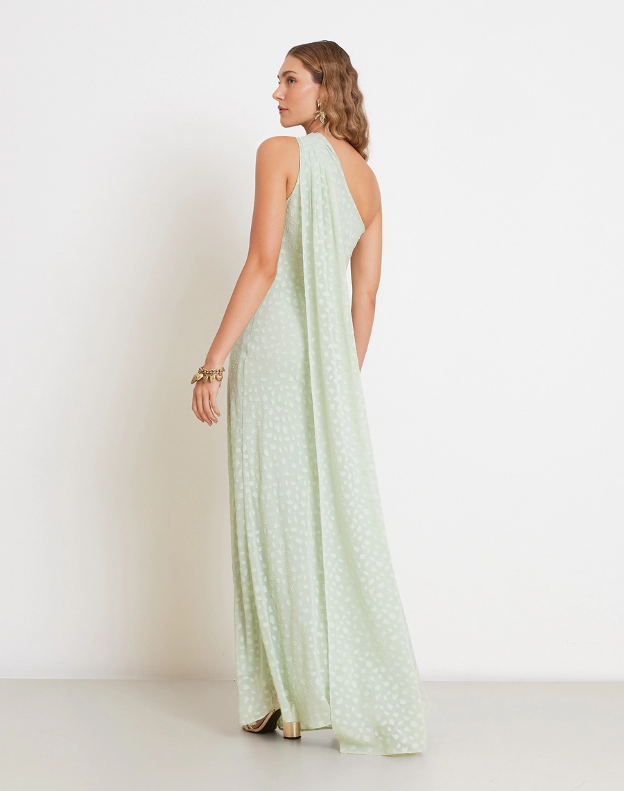 O Vestido Longo Kenya é confeccionado em tecido Jacquard, de aspecto texturizado e delicado, com padronagem sutil que valoriza a superfície da peça.