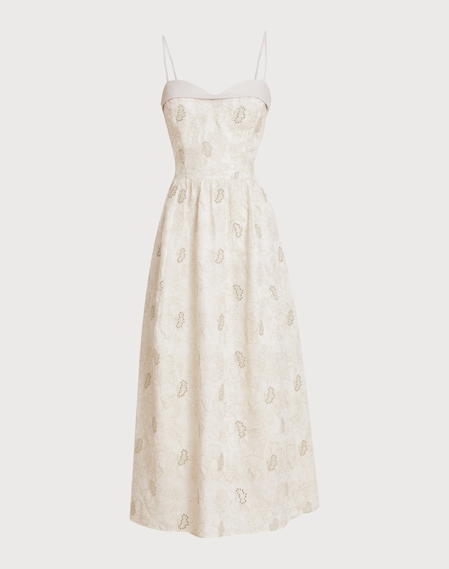 O Vestido Midi Rosi é confeccionado em Cambraia Bordada, com toque leve e delicado.