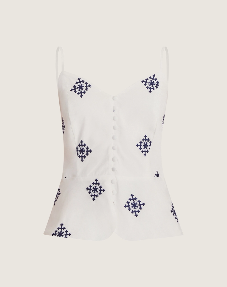O Top Andreza é confeccionado em cambraia bordada. É ideal para looks que transitam do dia à noite, combinando facilmente com saias ou calças para um visual moderno e sofisticado. 