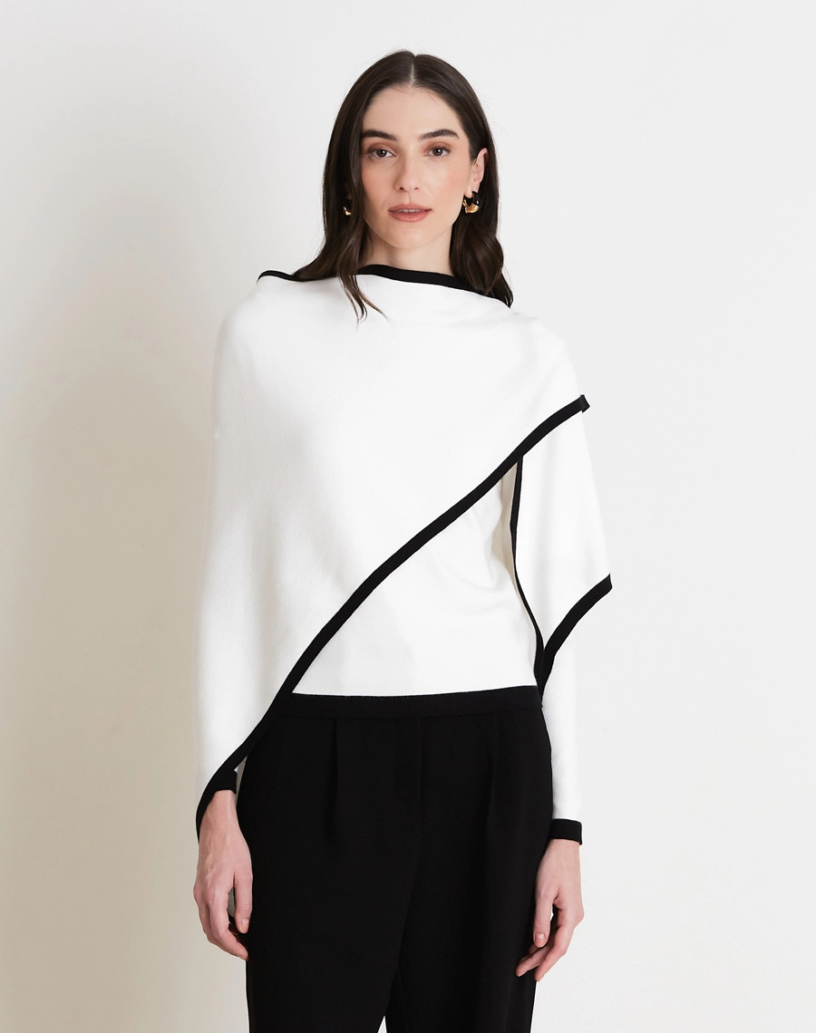 A Blusa Com Xale Coco é confeccionada em tricô, tecido leve, com toque macio e caimento fluido que proporciona conforto e elegância. 